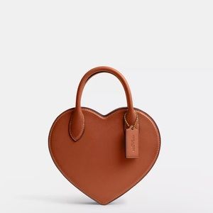 Coach heart bag in regenerative leather.